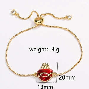 Detail of gold slider bracelet with red heart charm, flame motif and white zircon accents