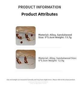 Detail view of sandalwood bead earrings with sizes 9x5.6cm and 6x5.5cm on white background