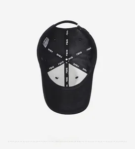 Detail view of cotton baseball cap interior with reinforced FBXS branding and care label