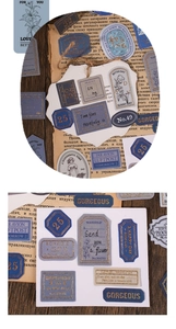 Close-up of vintage gold-stamped stickers with floral motifs for journaling decor