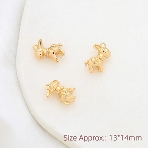 Macro shot of three gold elephant pendants featuring vintage patterns, size 13x14mm