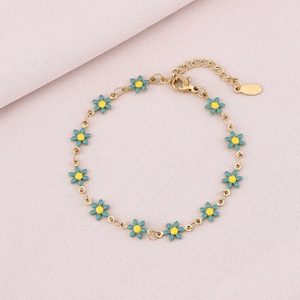 Gold stainless steel daisy bracelet with eleven blue enamel petals and adjustable chain