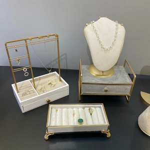 Modern gold jewelry display stand set with white and grey velvet trays for necklaces