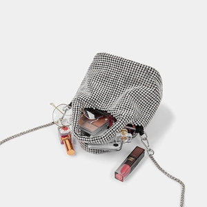 Elegant silver rhinestone bucket evening bag with metal chain strap and luxury essentials