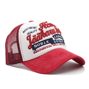 Red and white trucker hat featuring 3D letter embroidery and a premium suede brim