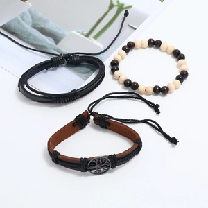 Detailed set of three leather and wood bead bracelets with a vintage tree of life metal charm