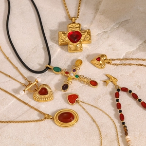 Vintage gold necklace set with red heart cross pendants and colorful gemstones