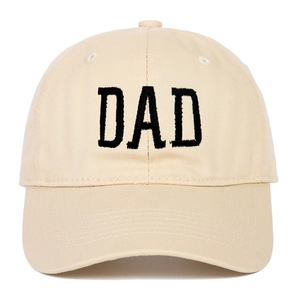 Close-up of black DAD embroidery on beige cotton baseball cap with premium texture