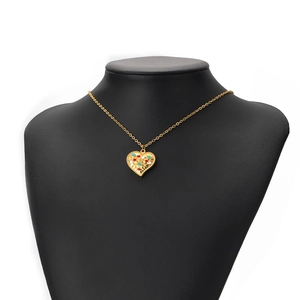 Golden heart necklace with multicolor dotted enamel on black neck model in white background