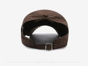 Detail of cotton baseball cap back showing adjustable metal buckle and inner embroidery