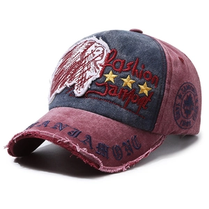 Retro washed canvas baseball cap with distressed brim and vintage Indian head embroidery