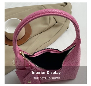 Pink woven hobo bag detail showing interior space, zipper, and small matching pouch