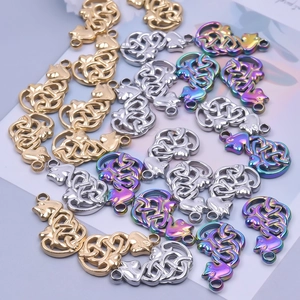 Detailed macro view of Celtic knot cat charms in gold, silver, and rainbow steel plating