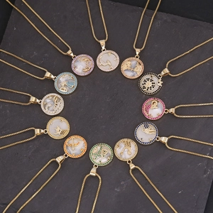18K gold 12 zodiac constellation necklaces set with colorful shell pendants on dark stone