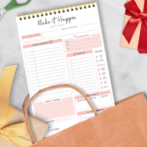 A5 English daily planner spiral notebook for time management, goal tracking and notes.