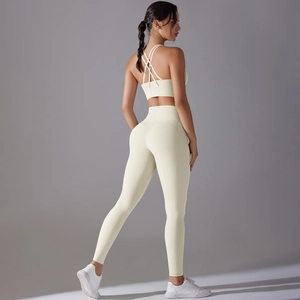 Detail view of the beige backless sports bra and high-waisted leggings yoga set