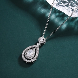 Detailed close-up of a pear-shaped cubic zirconia pendant on a silver-plated chain