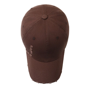 Distressed dark brown cotton baseball cap with vintage frayed holes and a curved brim