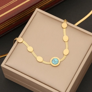 Collana in acciaio inossidabile dorato con ciondolo turchese e dischi tondi