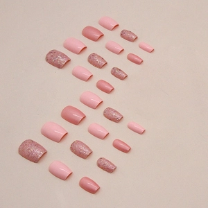 Short ballet press-on nails in soft pink colors with glitter sequins and glossy finish