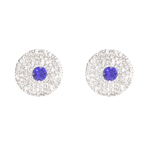 Detailed close-up of luxurious round stud earrings with a blue center stone and silver setting