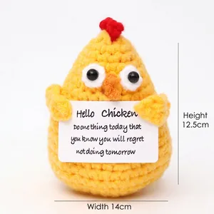 Detail view of handmade crochet yellow chick toy with dimensions 12.5cm by 14cm