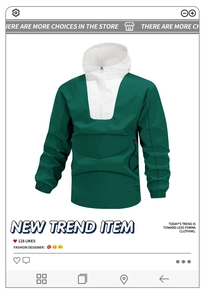 Dettaglio della giacca a vento color-block verde e bianca con mezza zip e tasca a marsupio