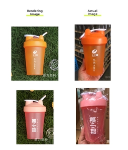Detail view of portable protein shaker bottles in pink and orange with mixing balls