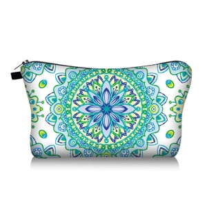 Close-up of mandala floral makeup bag with blue and green patterns and black zipper