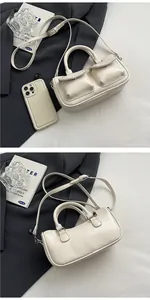Detail view showing front and back of cream PU leather saddle bag with double pockets