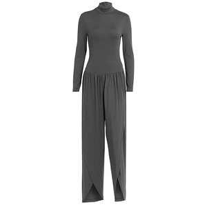Detail shot of grey high-neck jumpsuit with unique crossover split hem and pleated texture