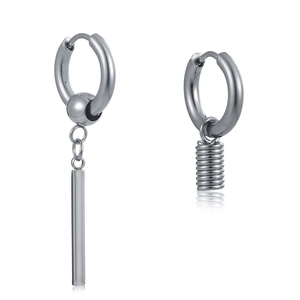 Close-up of asymmetrical silver stainless steel earrings with cylinder and spring charms