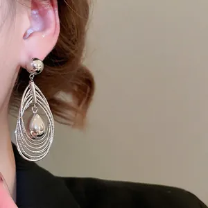 Silver multi-layered hoop earrings with polished teardrop pendant for women