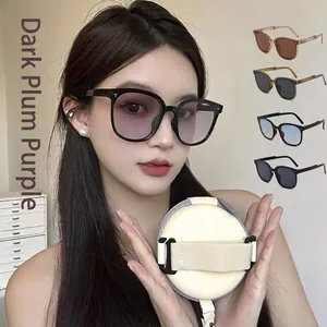 Fashionable oversized folding sunglasses in plum purple with a portable carrying case