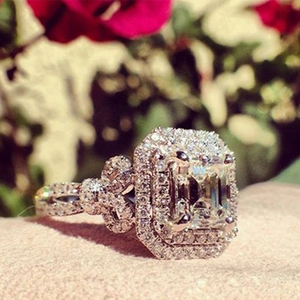 Classic copper silver-plated emerald cut zircon ring with double halo and twisted band