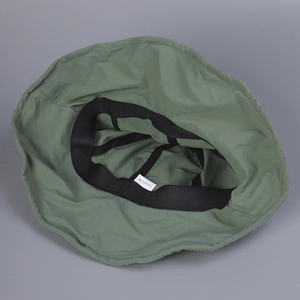 Detail view of the breathable nylon interior with a black sweatband and white wash label