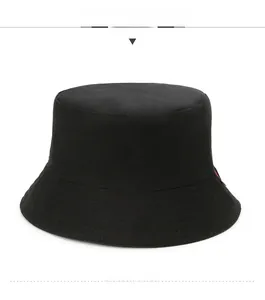 Close-up of a black cotton bucket hat with a flat top and durable stitched brim details