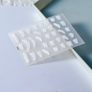 Detail shot of TS-144 3D embossed nail stickers featuring white plaster paint strokes