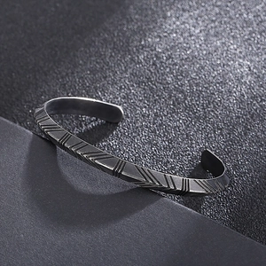 Minimalist black titanium steel open cuff bracelet with geometric arrow texture for men