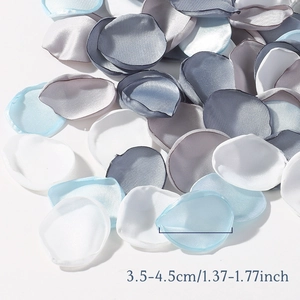 Blue silver and white silk rose petals for wedding decor sized 3.5-4.5cm on white surface