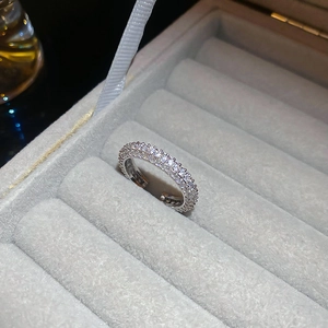 Detailed macro view of silver open ring with multi-row pavé cubic zirconia setting