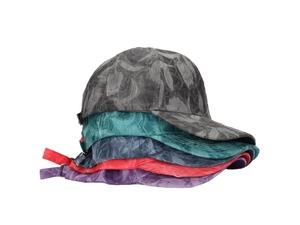 Detailed view of stacked baseball caps showing textured fabric and curved brims
