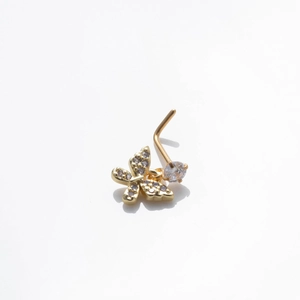 Golden butterfly nose stud with sparkling cubic zirconia pendant on white background