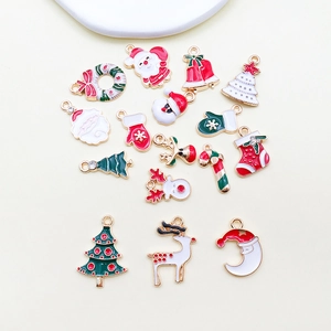 Detailed set of sixteen Christmas alloy charms including Santa and reindeer designs
