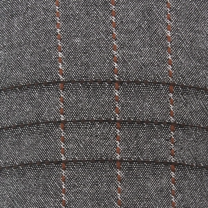 Detailed macro view of the grey and brown plaid pattern on the cotton newsboy cap fabric