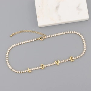 Detail of 18K gold plated tennis chain with LOVE letter charms and sparkling zircons