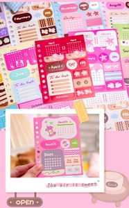 Close-up of colorful monthly calendar stickers and cute illustrated planner tabs