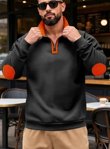 Detail of men's quarter-zip sweatshirt with orange contrast collar and elbow patches