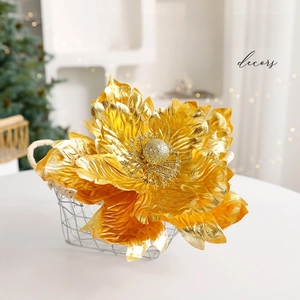 Golden artificial Christmas flowers with glitter in a wire basket for tree decoration