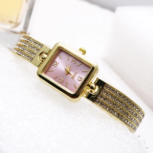 Elegant gold rectangle watch with pink dial and four-row rhinestone bracelet strap